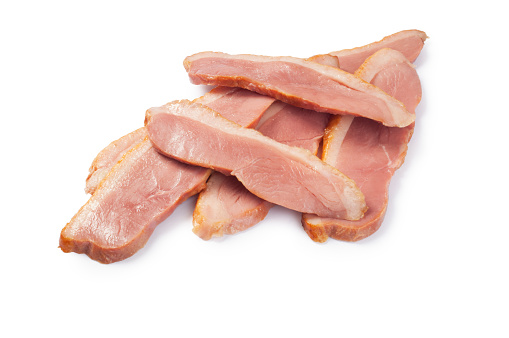 Studio shot of sliced duck breast cut out against a white background