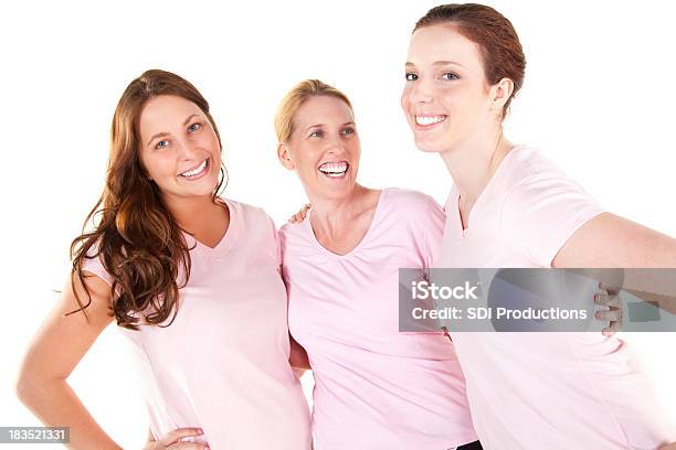 Foto de Mulheres Jovens Em Rosa Próximos e mais fotos de stock de Figura para recortar - Figura para recortar, Fita de Consciência para o Câncer de Mama, Mulheres