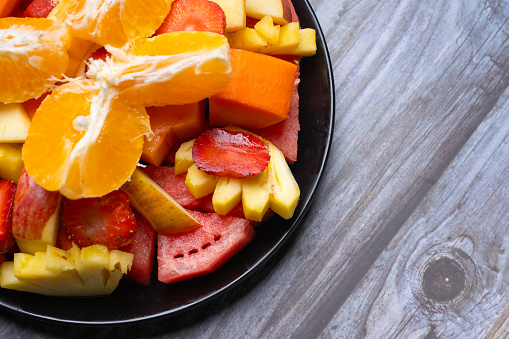 Fruit plate with water melon, pineapple, orange, papaya. Healthy food.