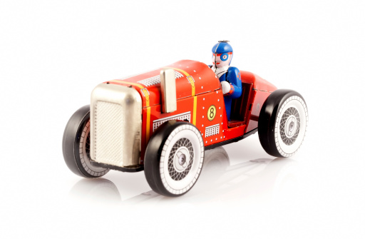 Red metal toy car with driver