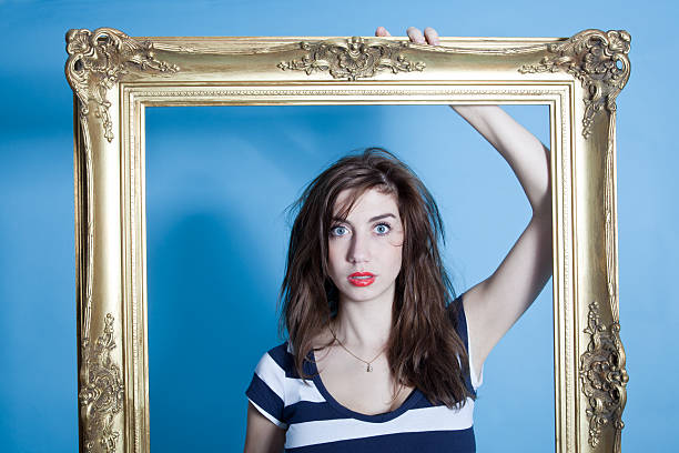 Young woman with golden frame.