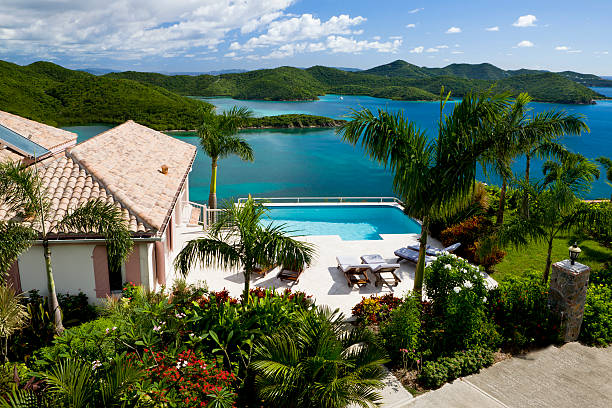 luxury Caribbean villa in the Virgin Islands - tropical vacation luxury Caribbean villa with a pool overlooking the Virgin Islands - perfect exotic vacation getaway caribbean sea photos stock pictures, royalty-free photos & images