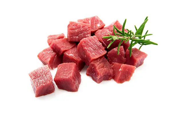 Dicet meat with rosemary herb on white background