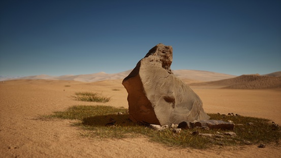 A lone rock, weathered by time, stands isolated in the vast expanse of the desert, embodying the arid solitude of its surroundings.