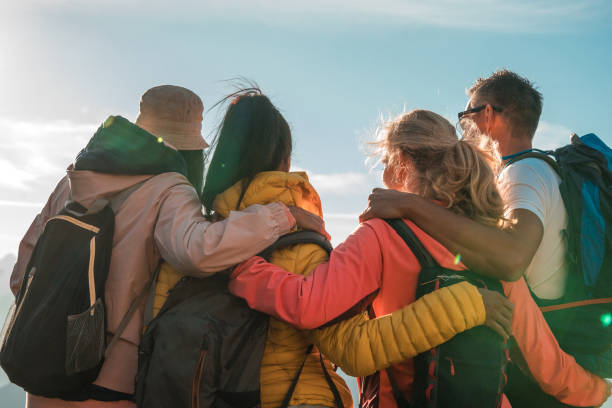 istock Diverse Group Embracing and Enjoying Mountain Trek on a Sunny Day 1835249864