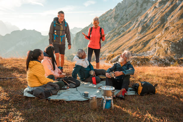 istock Diverse Group Trekking to Hilltop with Tea Break 1835252033