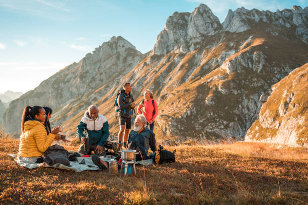 istock Diverse Friends Enjoying Tea Break on Hilltop 1835252268