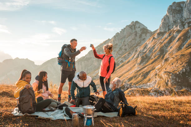 istock Diverse Group Drinking Tea and Embracing Fresh Air on Hill 1835252367