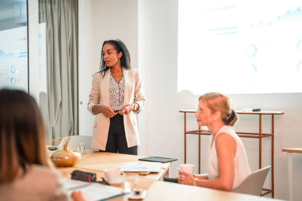 istock Latin Woman Leading A Corporate Presentation 1835254222
