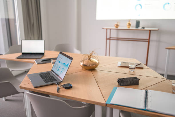 istock Marketing Office Setting With Laptops And Wall Projection 1835254783