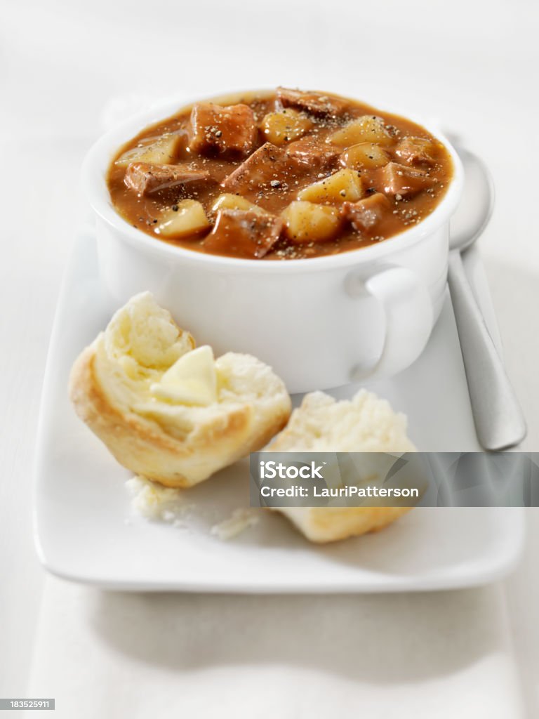 Steak and Potato Stew with Freshly Baked Biscuits Steak and Potato Stew with Freshly Baked Biscuits and Melting Butter- Photographed on Hasselblad H3D2-39mb Camera Beef Stock Photo