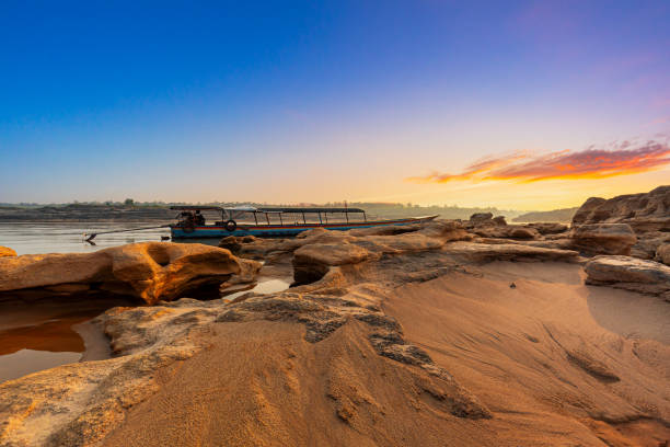 istock Ubon Ratchathani,Sunrise landscape photo with boat, mountain,Sam Phan Bok, Ubon Ratchathani, Thailand 1835262849