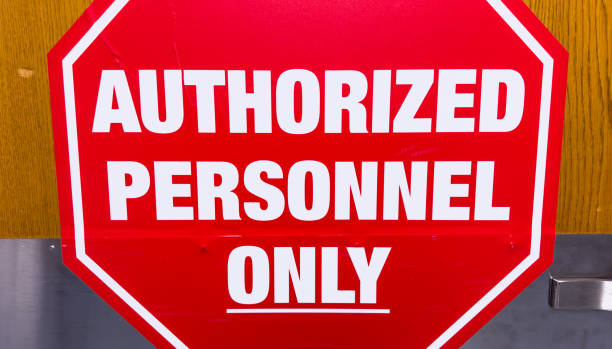 istock Authorized personnel sign against industrial backdrop, emphasizing restricted access and safety protocols 1835263376
