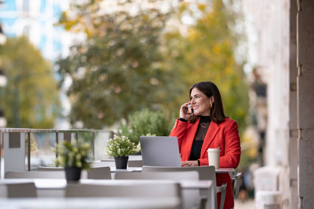 istock Woman on the phone at cafe 1835269932