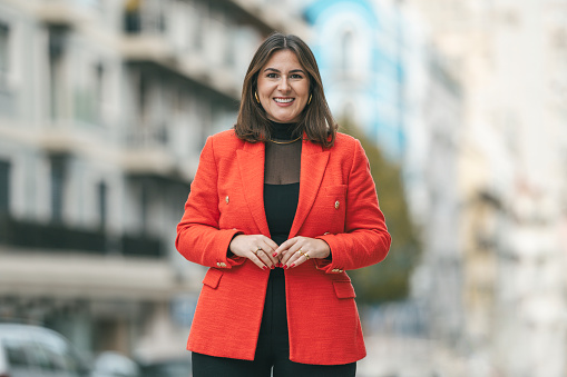 Portrait of businesswoman wearing red blazer