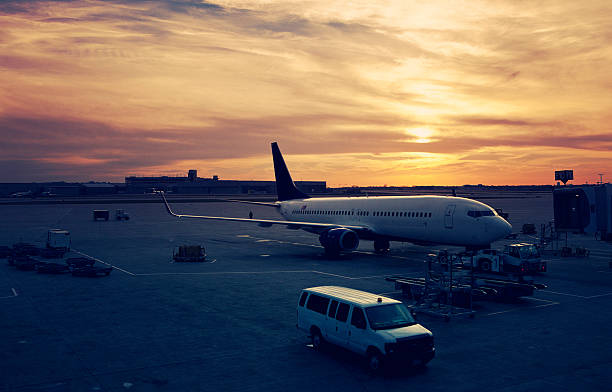 behind the scenes at minneapolis airport at sunset - planes at the gates
