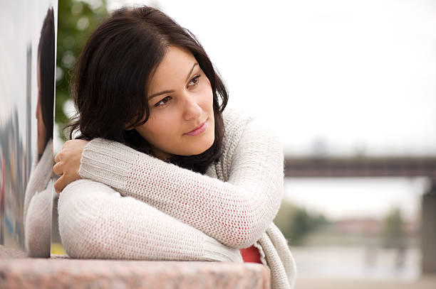 Young woman in her thoughts