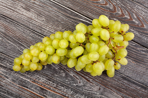 sultana grapes on wood background