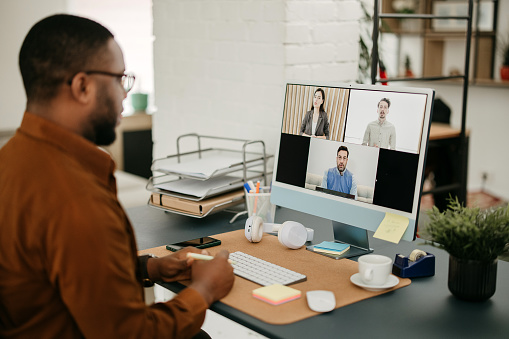 Man have meeting online in his home office