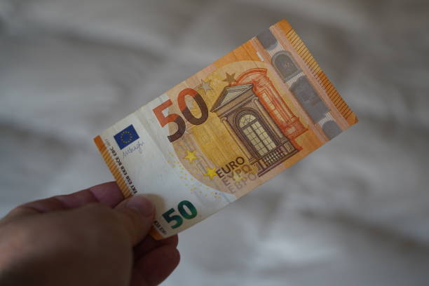 istock Person holding a EURO bill 1835302806