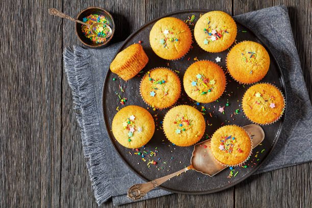 istock sweet lemon muffins on black plate, flat lay 1835309947