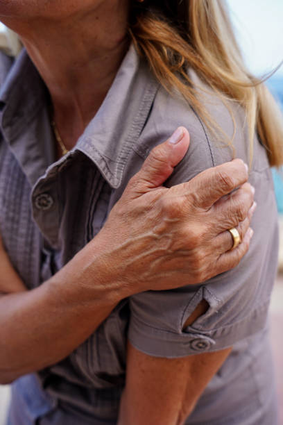 istock Unrecognizable woman touching shoulder causing pain 1835312427
