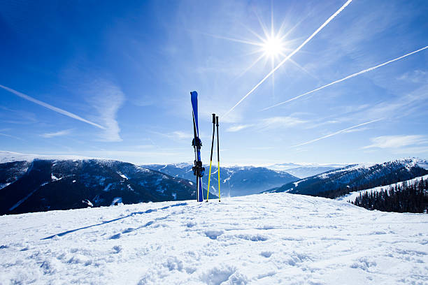 istock Skis on top of slope against sun 183532957