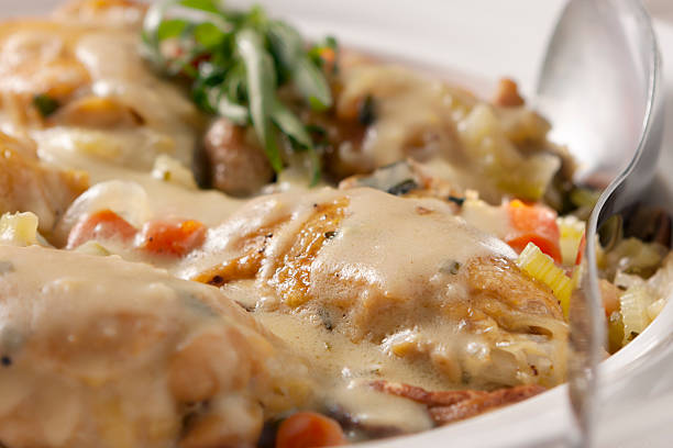 Chicken Tarragon "The french classic with made with chicken thighs, carrots, onions, mushrooms, and finished with a tarragon infused cream sauce." tarragon horizontal color image photography stock pictures, royalty-free photos & images