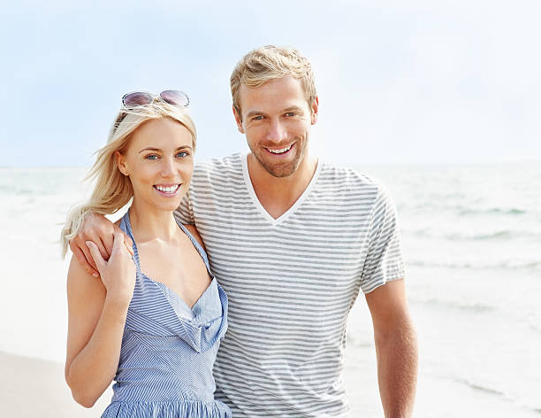 istock Sweet young couple enjoying their vacation on beach 183533378