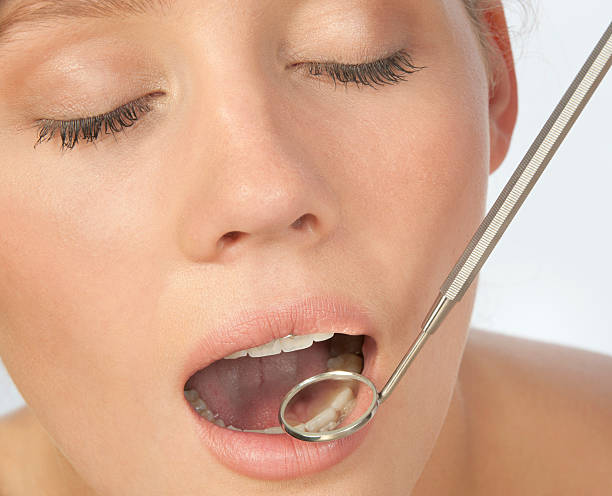istock Female patient during dental check up 183534013