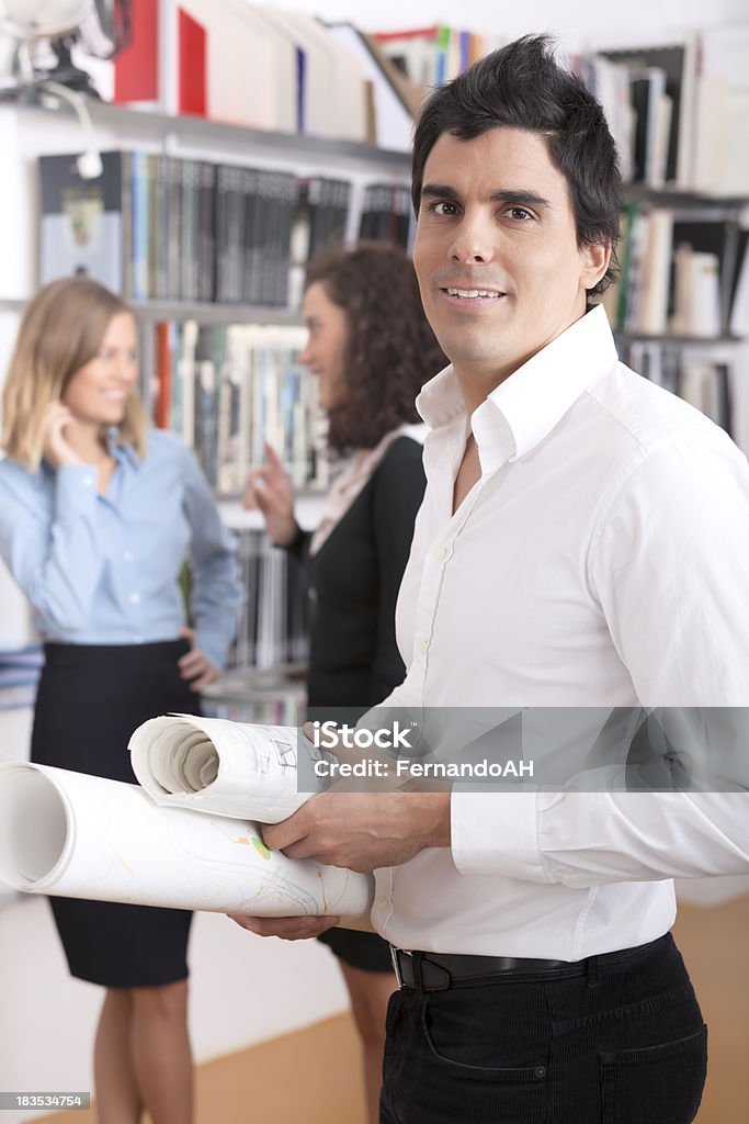 Architects at work Male and female architects at work. 20-29 Years Stock Photo