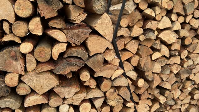 Stack of firewood. Pile of wood.