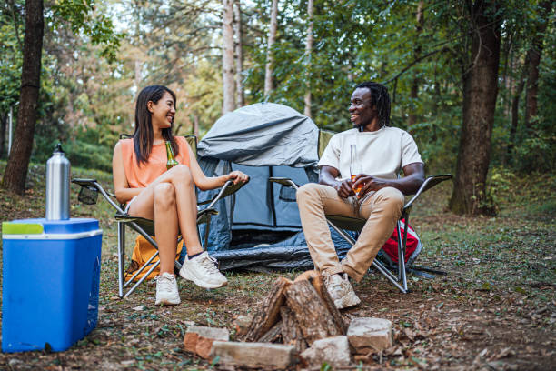 istock Friends enjoying while camping in the forest together 1835355717