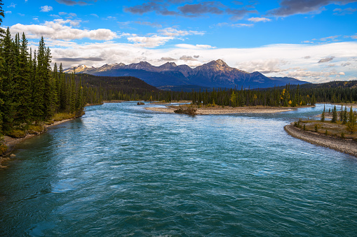 Summer view of Athabasca River with Pyramid Mountain backdrop on Icefields Pkwy, Jasper National Park, Alberta, Canada