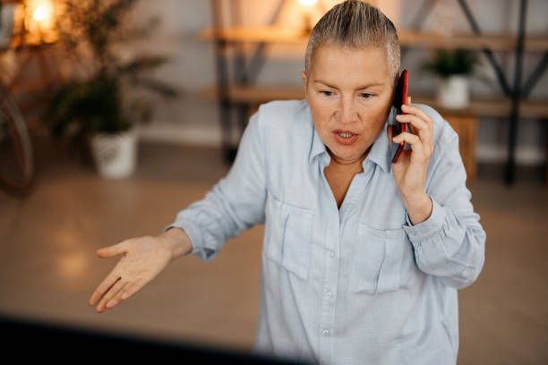 istock Angry woman talking on phone 1835368404