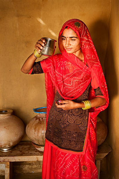 istock Indian woman drinking cold water 183537385