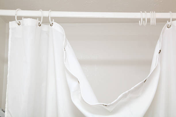 hanging dangling broken  white shower curtain with hooks