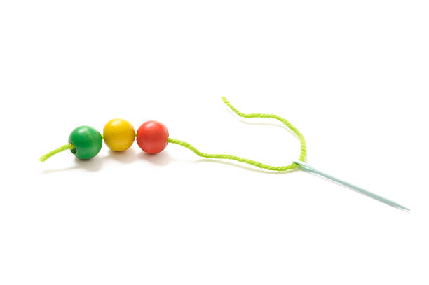 Short chain with colored wooden beads. Isolated on white.