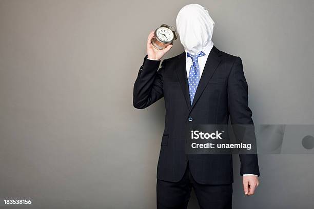 Faceless Man Playing With A Table Clock Stock Photo - Download Image Now - Adult, Adults Only, Aluminum