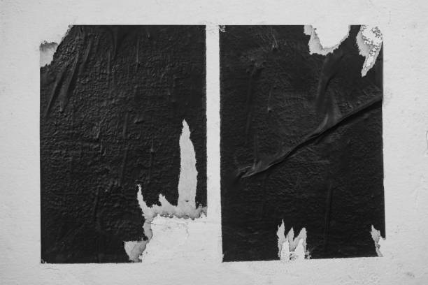 istock Scraps of two black posters on a white background. 1835384163