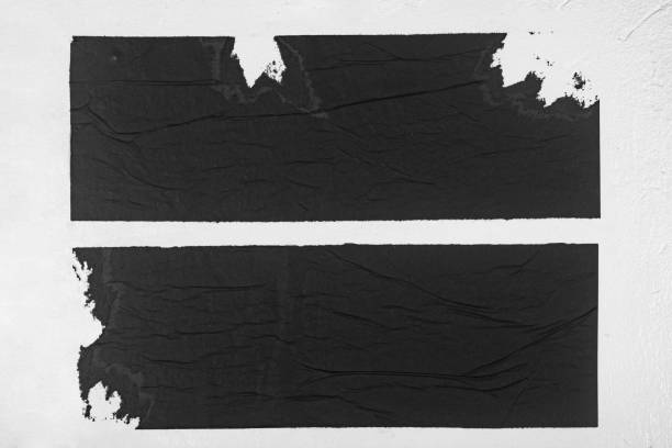 istock Two strips of black paper on a white background. 1835384176