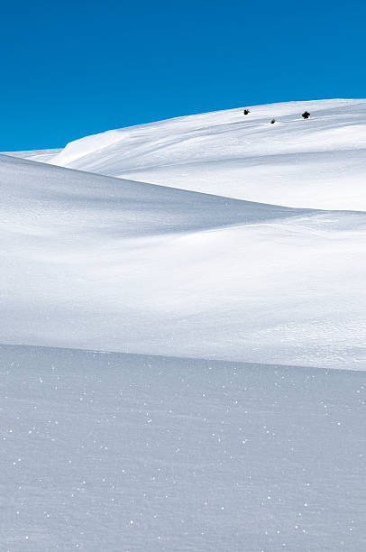 istock Nordic landscape, snowy hump and bright blue sky 183538540