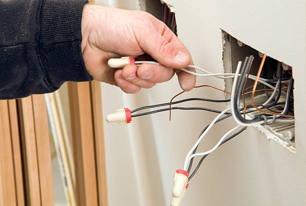 istock Electrician Holding Hot Wire at a Residential Construction Site 183538622