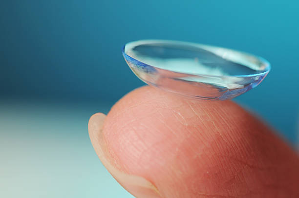 Contact Lens on blue background stock photo