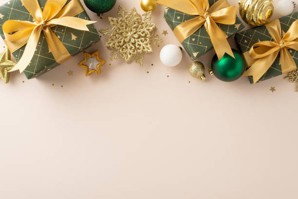 istock Charming New Year setting. Top view shot showcasing tastefully wrapped presents, luxurious baubles. Candle and gold sequins create radiant display on light beige backdrop. Perfect for greetings or ads 1835394882