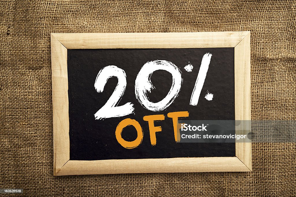 Twenty percent off Twenty percent off, discount tag on blackboard. Badge Stock Photo