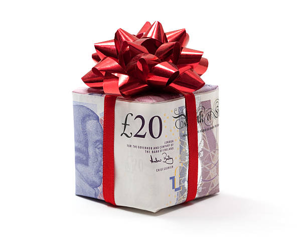 Pound gift Present made of A#20 note on white background british currency stock pictures, royalty-free photos & images