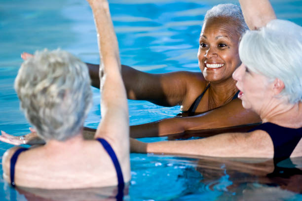 istock Multiracial senior women in water aerobics class 183539652
