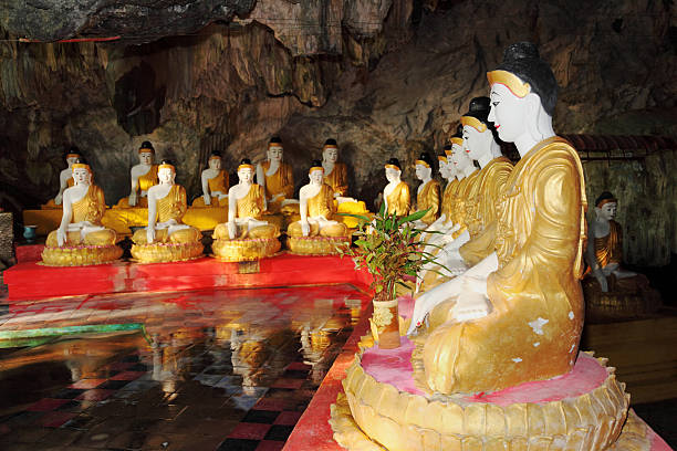 istock line of buddha statues in cave temple 183539801