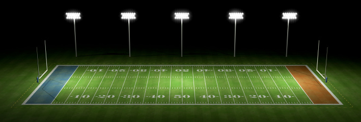 American football field at night with flood lights.Could be a useful element in a sports composition.This is a detailed 3d